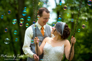 bride and groom bubbles swingset park wedding