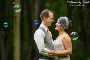 outdoor wedding bubbles bride and groom