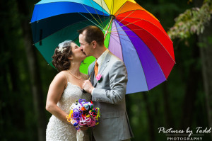 unique wedding umbrella kiss outdoor wedding