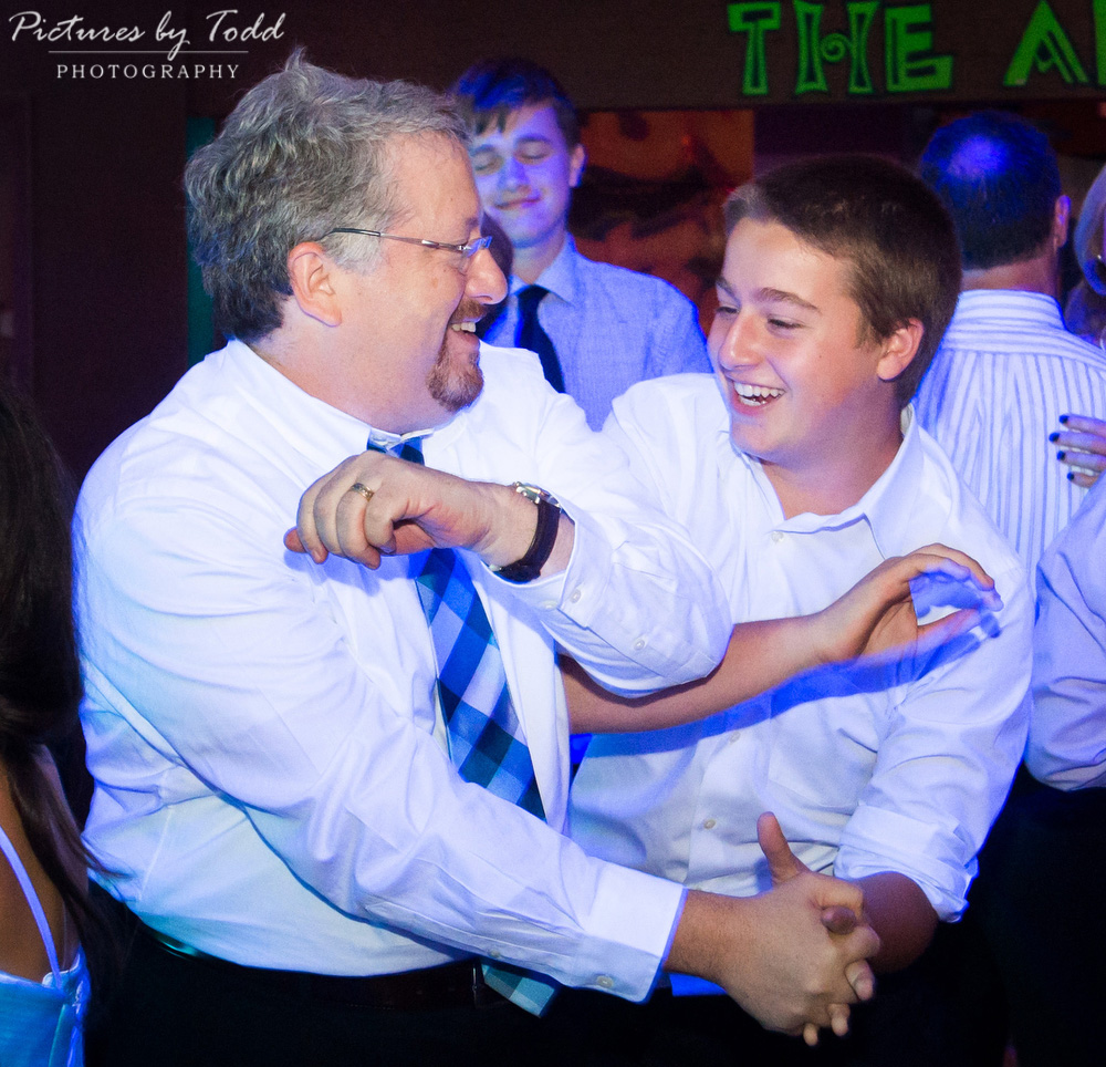 family-fun-bat-mitzvah-smile-moment-candid-father-son